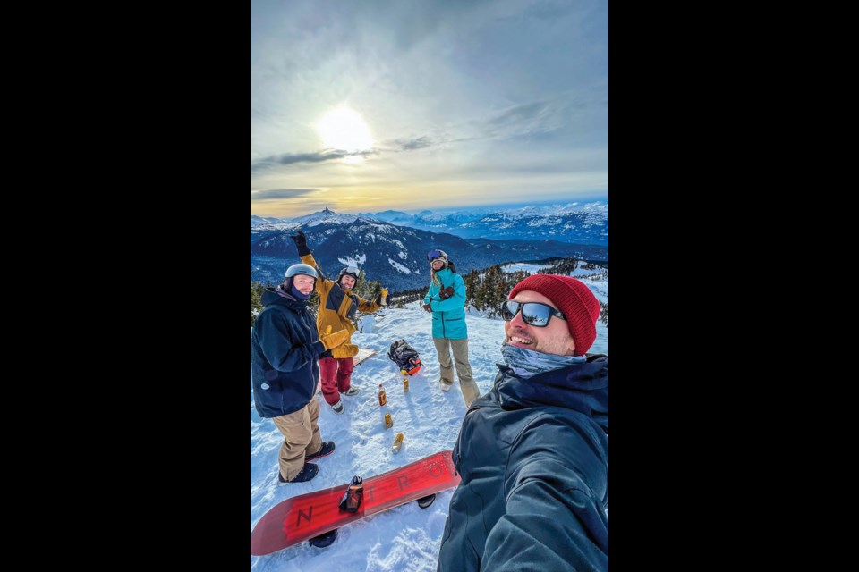 PEAK VIEWS These friends took a break from snowboarding to snap a pic with the iconic Black Tusk on a clear day. 
