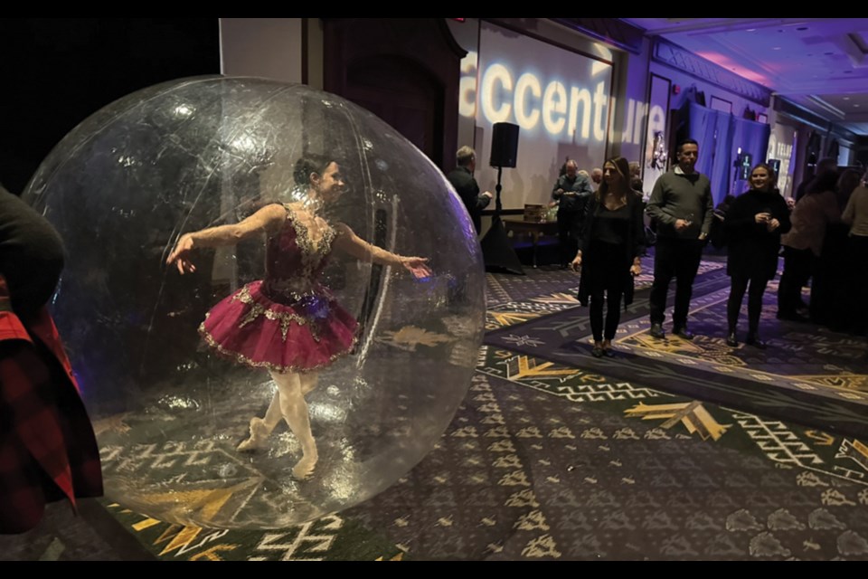 WHISTLER BUBBLE A dancer protects her personal space while entertaining the crowd during the Whistler Blackcomb Foundation’s Telus Winter Classic “Winetastic” event at the Fairmont Chateau Whistler on Friday night, March 3. 