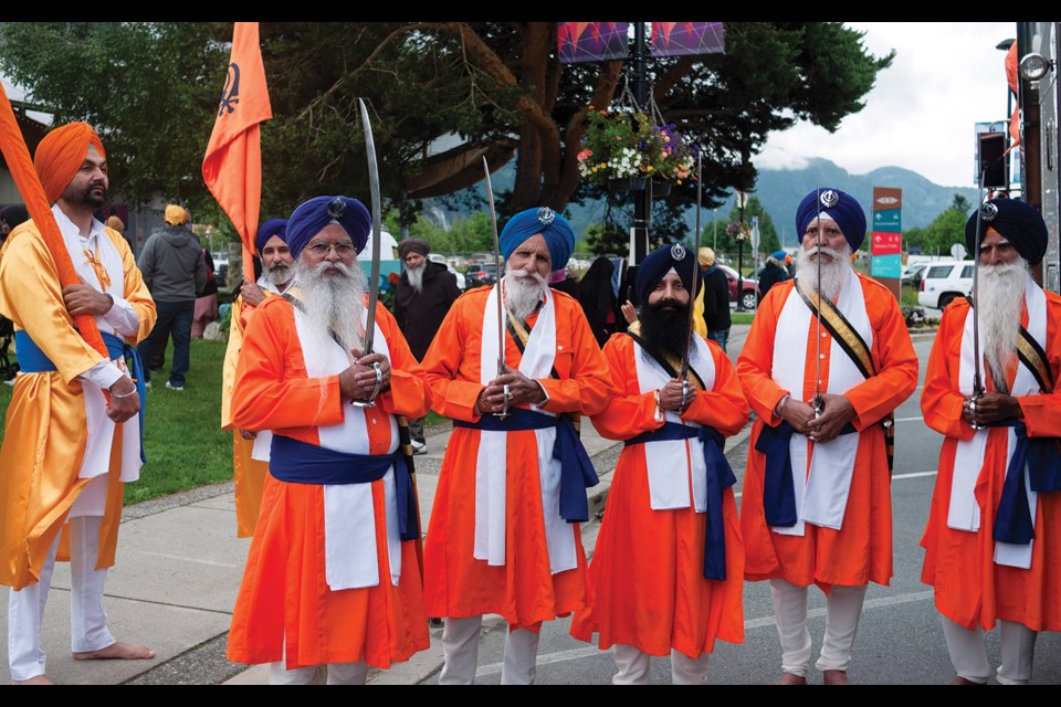 JOIN THE PARADE Members of Squamish’s Sikh community at the Squamish Sikh Society’s festival and parade held in Squamish June 18—the first since 2019.