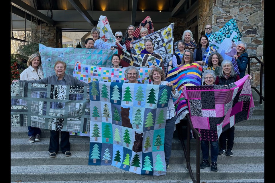 QUILT ENVIRONMENT The Whistler Valley Quilters’ Guild shows off its recent efforts to “wrap our community in warmth and love” at an event hosted by the Fairmont Chateau Whistler.