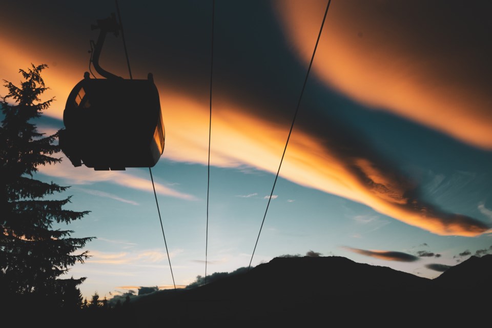 FRIDAY NIGHT LIGHTS After a long day in the bike park, Jake Stewart grabbed his camera to capture the orange glow lighting up the sky in Whistler. 