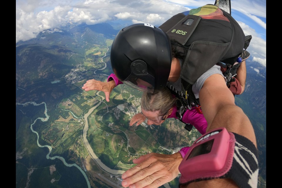 JUMPING INTO RETIREMENT X-ray technologist Heather Hall leaped into retirement––literally. At 70 years old, she retired from the Whistler Health Care Centre and was gifted an exit from an airplane with Whistler Skydiving by her employer. Here she is with Pemberton Valley far below. 