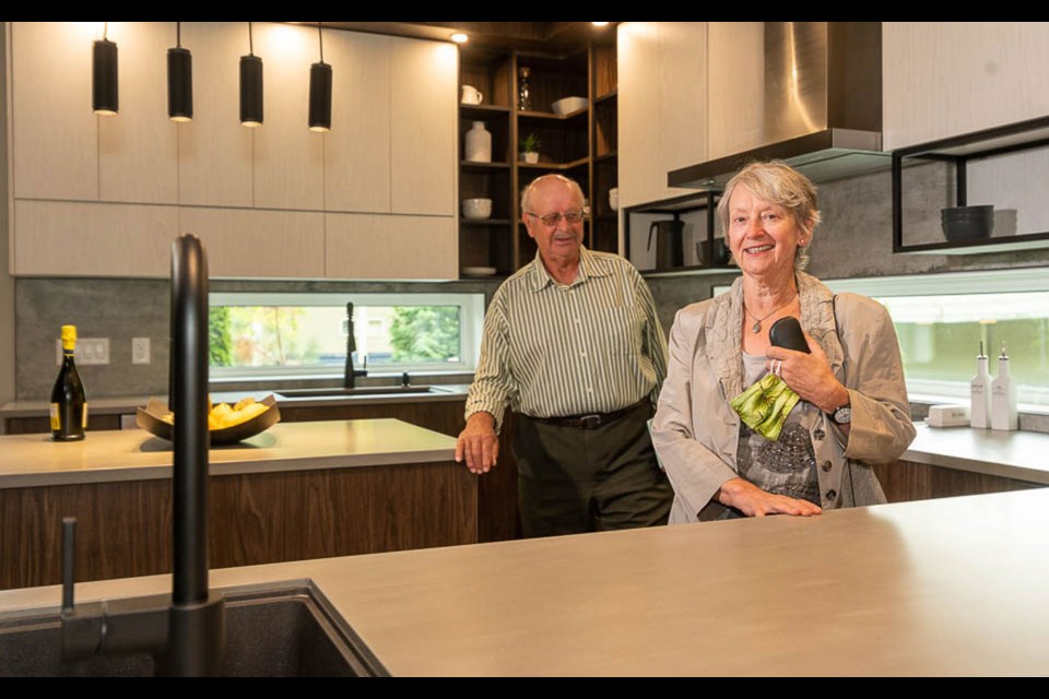 Fritz and Heidi Kym tour their PNE Prize home. Photo by Allen Lau Photography