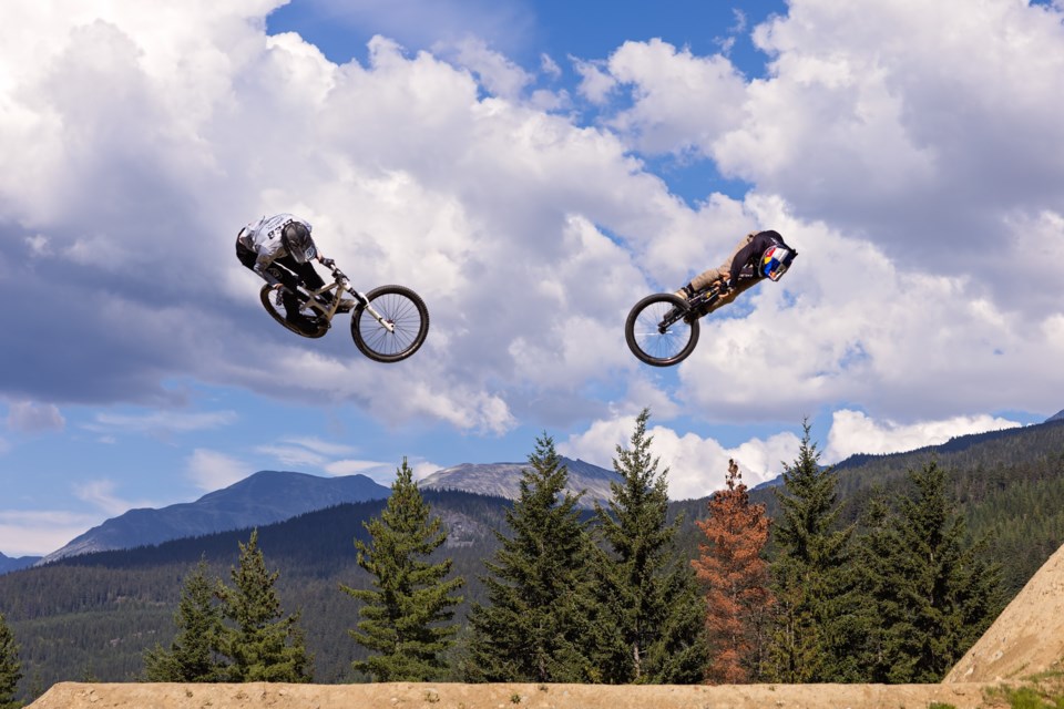 Two riders soar through the air at the 2023 Crankworx Whistler Speed & Style.