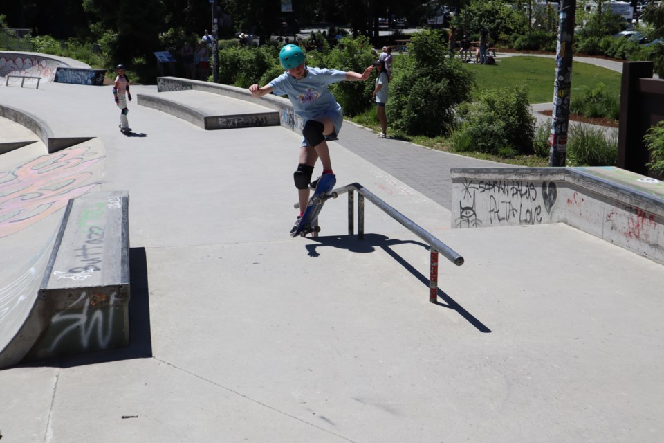 Real Wild Kittens coach Amalia Pelchat pulls off her first board slide during the Mayhem in the Mountains competition last weekend.