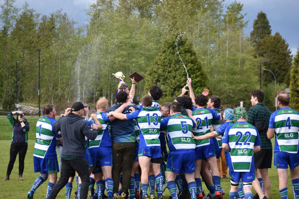 The Sea to Sky Axemen pop some bubbly as they celebrate their BC Rugby Division 2 championship win on Saturday, May 7 in Surrey.