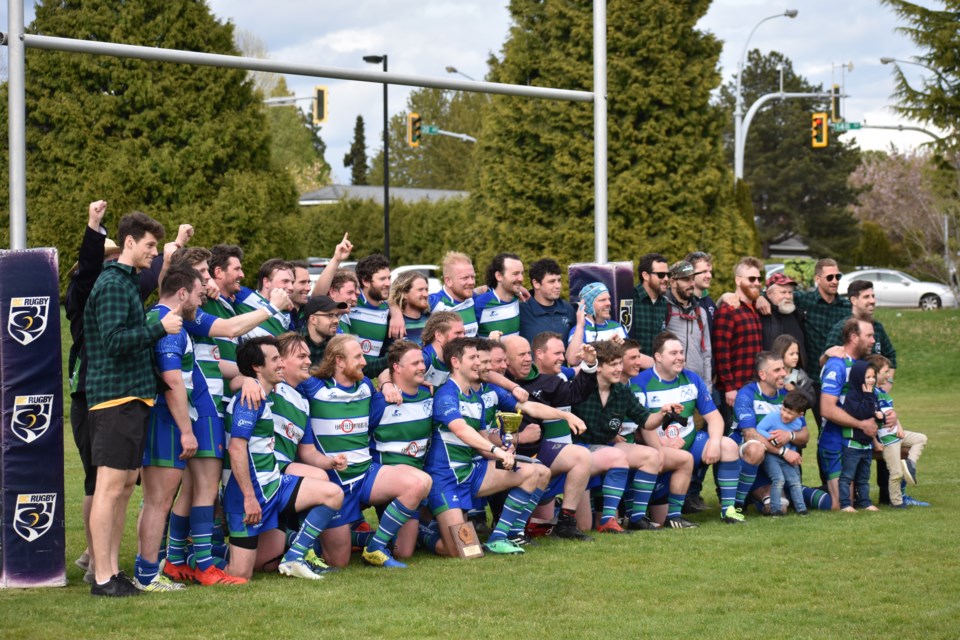 The Axemen pose for a picture with the BC Division 2 trophy after their 30-15 win in the grand final against Surrey. 