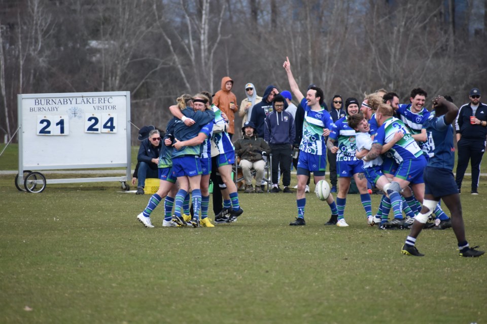 Axemen Rugby Club players celebrate after upsetting Burnaby Lake in the 2023 BC Rugby postseason.