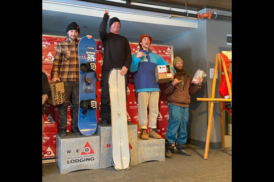 Chris Dimma (middle) stands atop the podium at a freeride event in Red Mountain. 