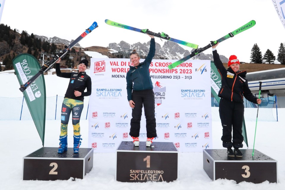 Emeline Bennett (centre) stands atop the podium at the 2023 World Ski Cross Juniors. 