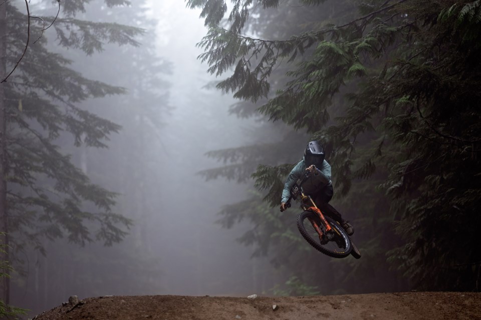 Georgia Astle looms like a spectre in the fog during the 2023 Crankworx Whistler Air DH. 
