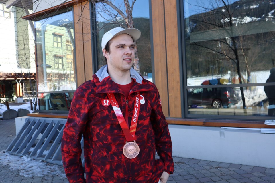Jack Crawford poses with his historic Olympic bronze medal at a media availability in Whistler last winter.