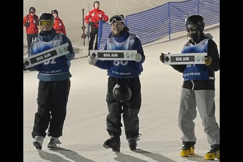 Jordan Peet (centre) poses with her fellow podium finishers after winning big air gold at the 2023 Canada Winter Games. 