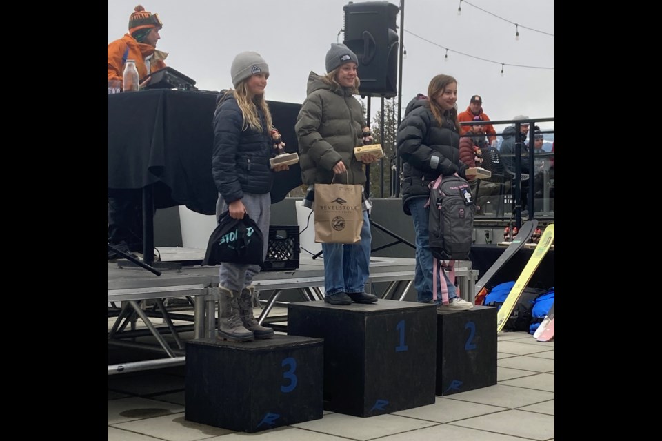 Josie Cooper (middle) stands atop the U12 podium at the 2023 IFSA Junior Regional event in Revelstoke.