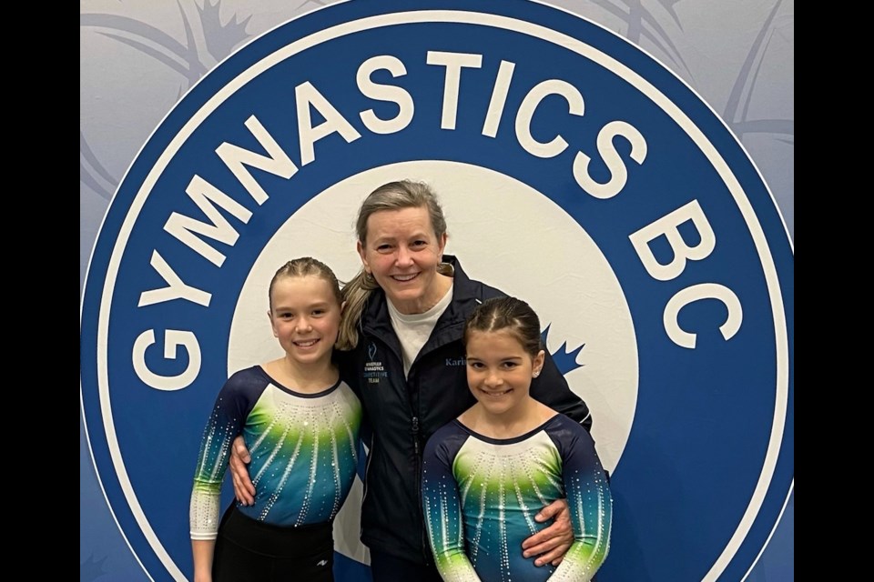 Whistler Gymnastics coach Karin Jarratt (middle) with two of her young athletes.