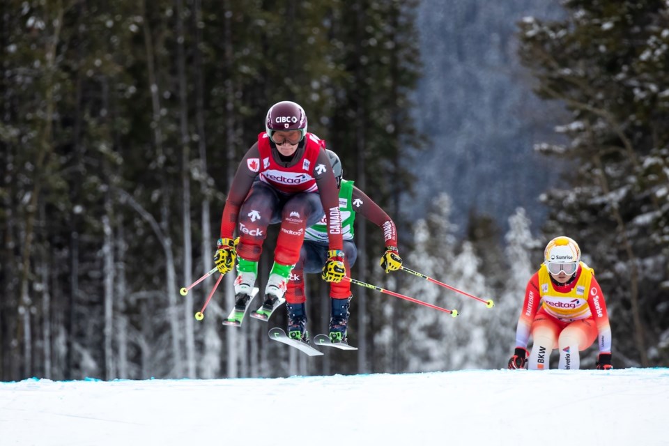 Marielle Thompson (front) leads Brittany Phelan and Margaux Dumont during a World Cup race in Nakiska on Jan. 20, 2024. 