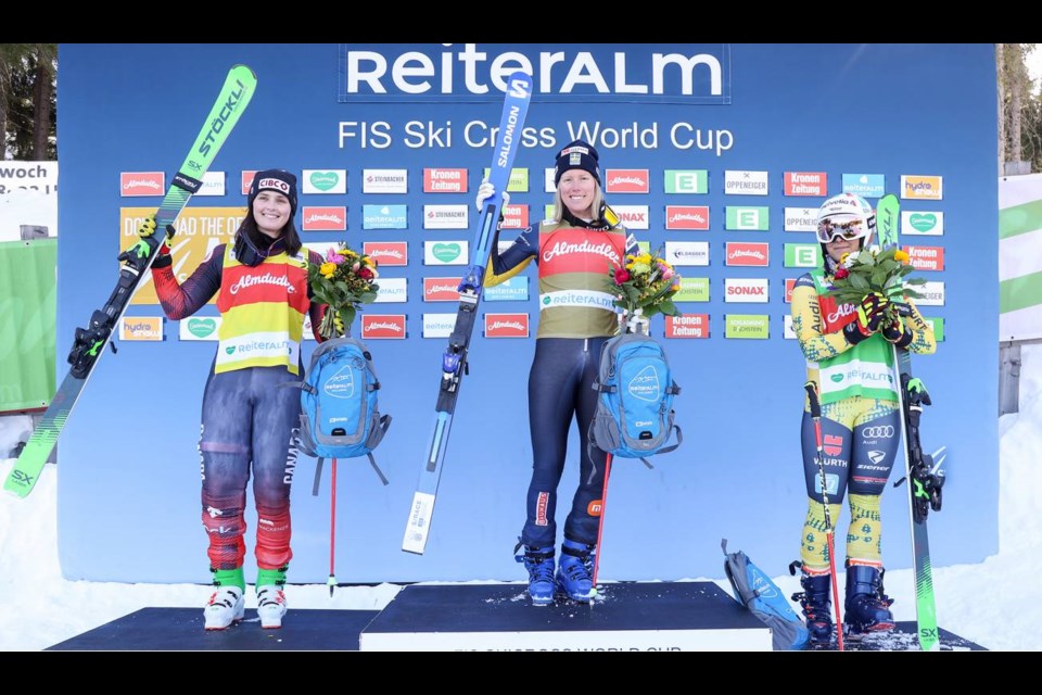 Marielle Thompson (left) stands on the podium after an FIS World Cup ski cross race in Austria on Feb. 16, 2023.