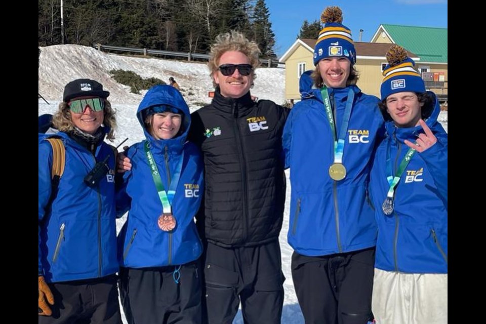 Jordan Peet (second from left), Tate Garrod (second from right) and Aidan Mulvihill (far right) pose with their medals at the 2023 Canada Winter Games.