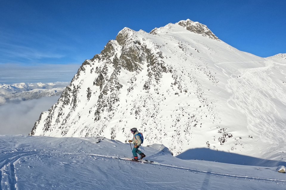 Rowan Gormick of Whistler climbing Disease Summit. 