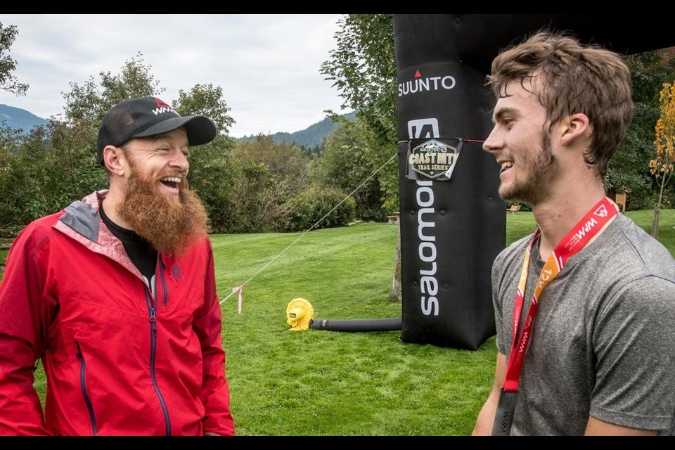 Gary Robbins, left, greets a finisher at one of the previous Whistler Alpine Meadows races he helped organize in Whistler. 