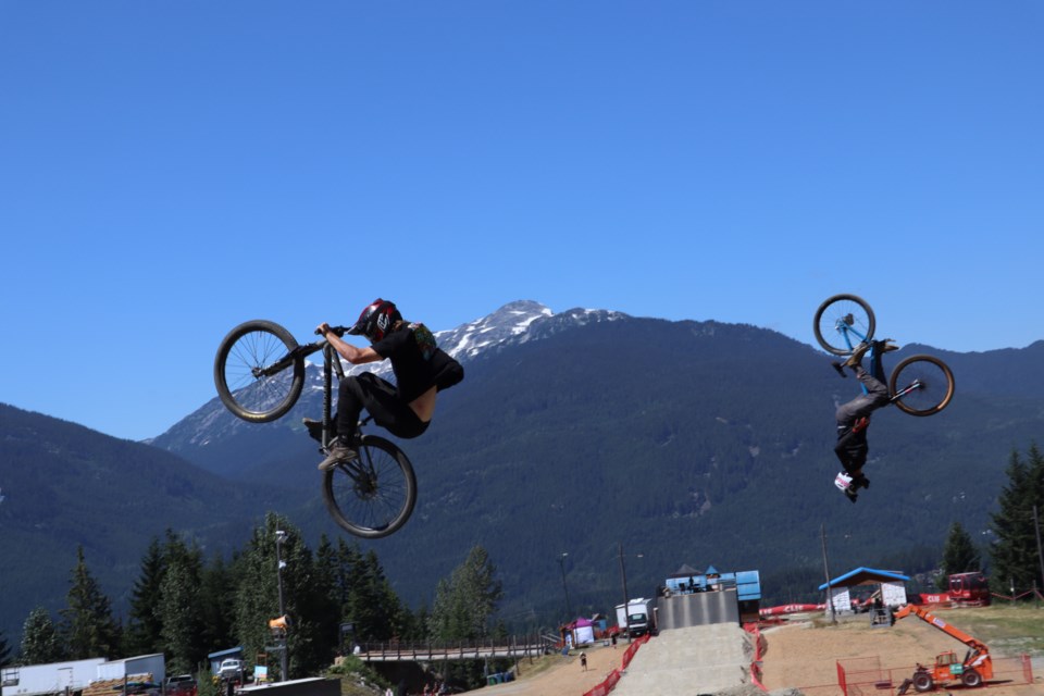 A couple riders pull off simultaneous tricks during Speed and Style on Thursday.