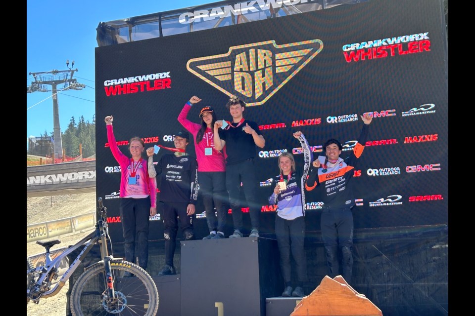 The 2025 U19 Crankworx Whistler Air DH podium, left to right: Megan Bedard, Luke Mallen, Indy Deavoll, Anthony Shelly, Zanna Logar and Pedro Abrigo. 