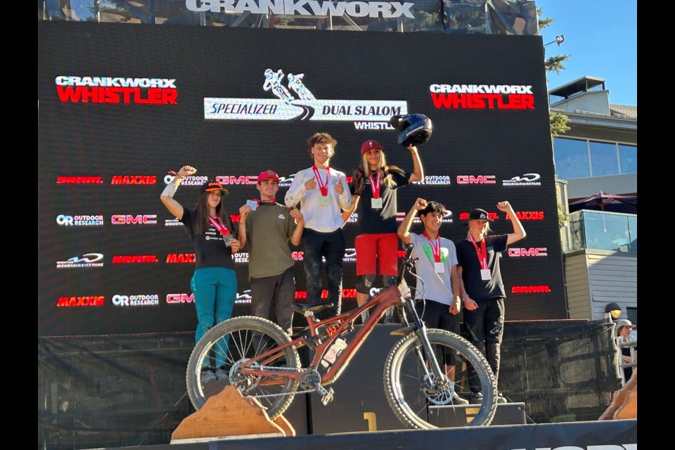 The 2025 U19 Crankworx Whistler dual slalom podium, left to right: Indy Deavoll, Rafe Hudson, Anthony Shelly, Alyana Van Horn, Jed Fleming and Emily Wilson.