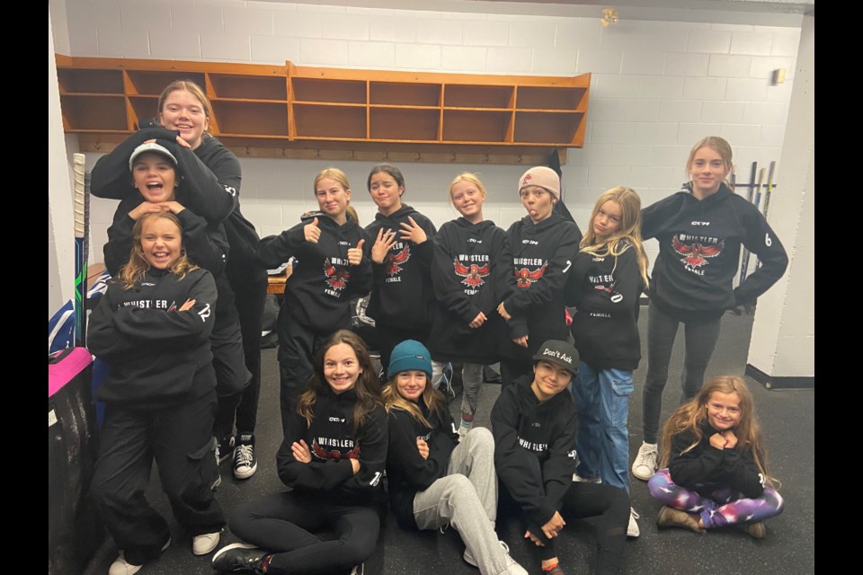The Whistler Winterhawks U13 girls' hockey team in their locker room. 