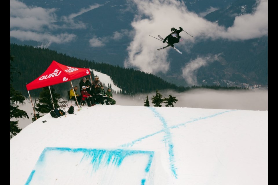 Zoe Greze-Kozuki performs a switch 700 mute grab at the 2025 Canadian Freestyle Championships in Whistler.