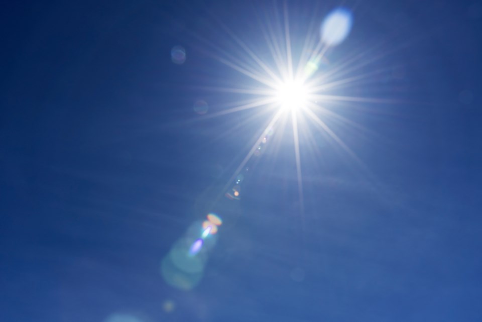 sun lens flare - blue sky - global warming - summer heat wave