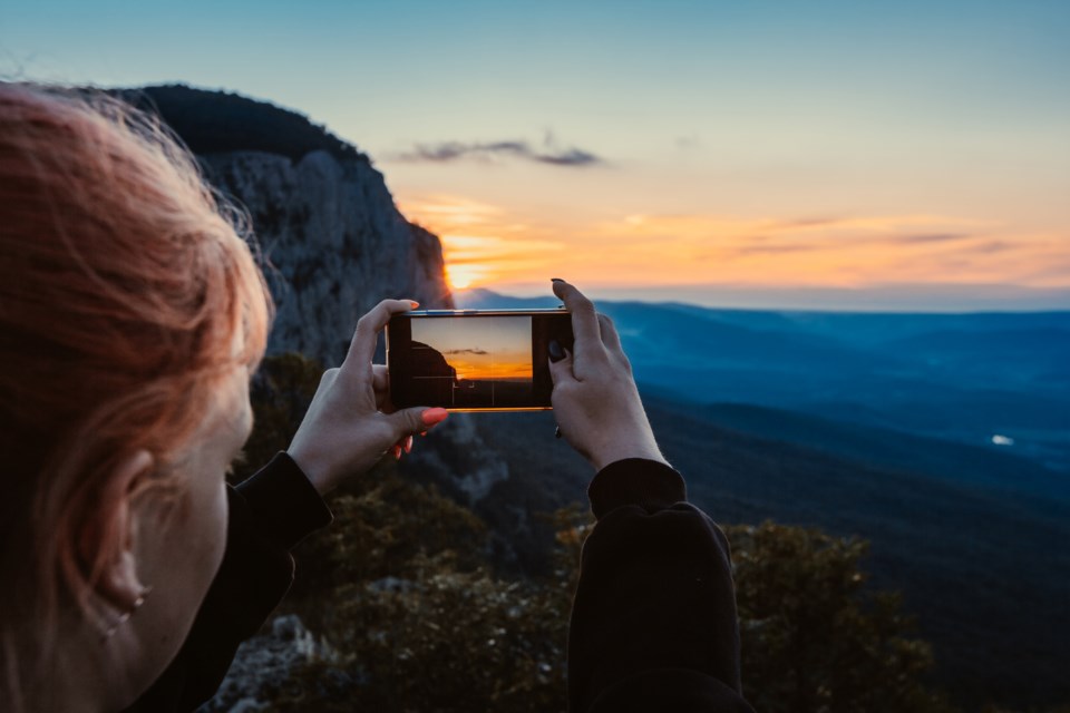 taking a photo filming outdoors 