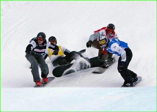 Quebec's Jasey-Jay Anderson (far left) holds on to take the hole shot in World Cup snowboardcross, just ahead of Americans Seth Westcott and Jayson Hale (26) and France's Pierre Vaultier (16). Photo by Just Jeskova