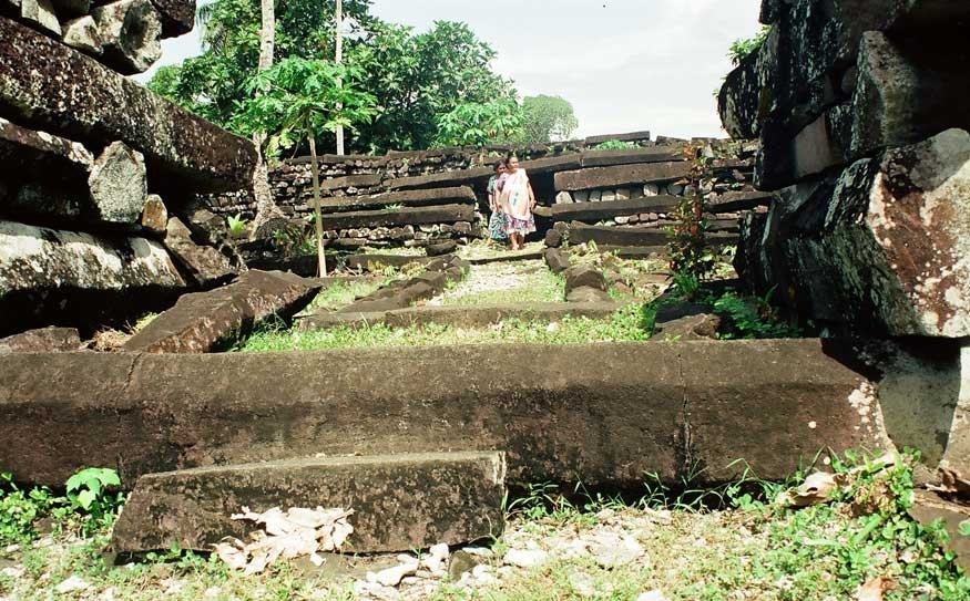 Walkers explore the ruins of Nan Madol, built on basalt columns for the dynasty that ruled the island until it was overthrown in the 16th century. PHOTO CREDIT Mitchell Smyth/Meridian Writers' Group