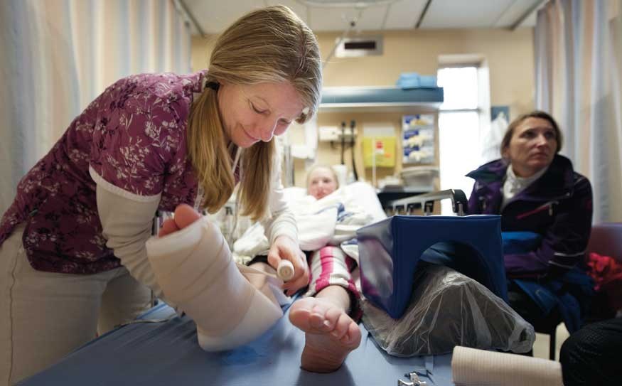 Nurse Shirley Balzarni adds a splint to skier Sarah Ussher of Langley at the Whistler medical center. Bonny Makarewicz Photo