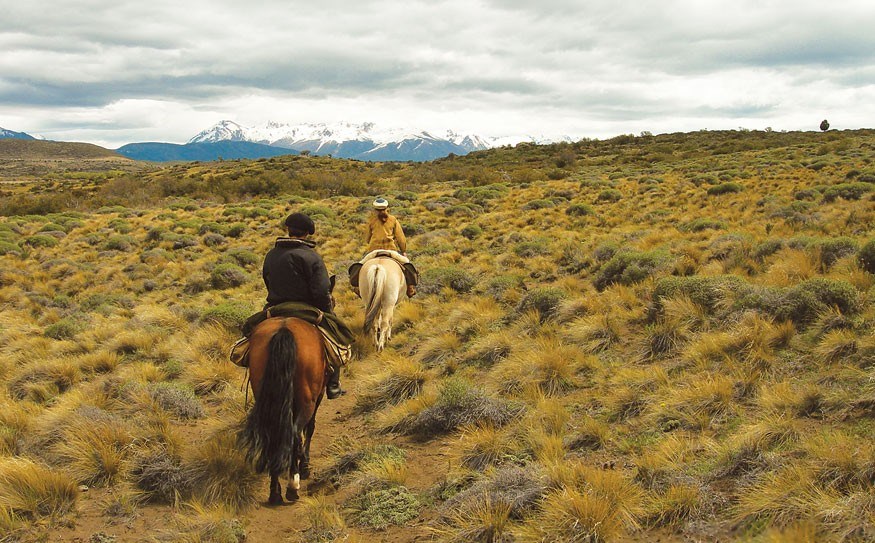 Trotting off-trail with the Andes on the horizon. Photo by Dave Clendenan