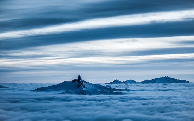 Deep Sky David McColm shoots iconic Black Tusk above the clouds. He spends 40-60 nights each winter standing on windy peaks and recording the beauty of Whistler's skies. Tourism Whistler/Behind the Lens
