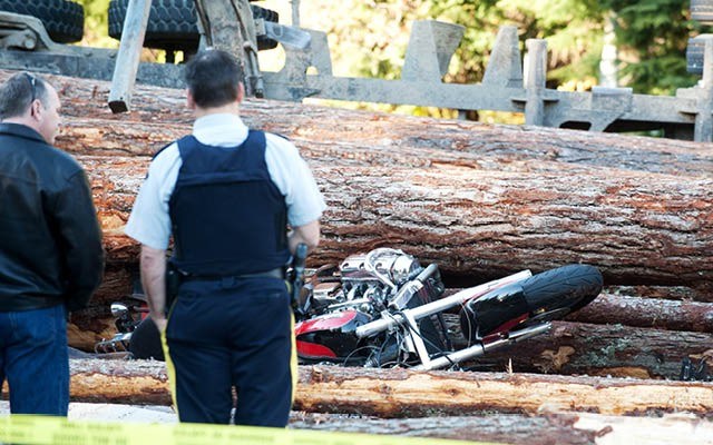 TREE TRAGEDY A logging truck flipped over and spilled its load on Highway 99 at Nordic Drive at 2:30 p.m. on Saturday, Oct. 19. David Buzzard / www.davidbuzzard.com