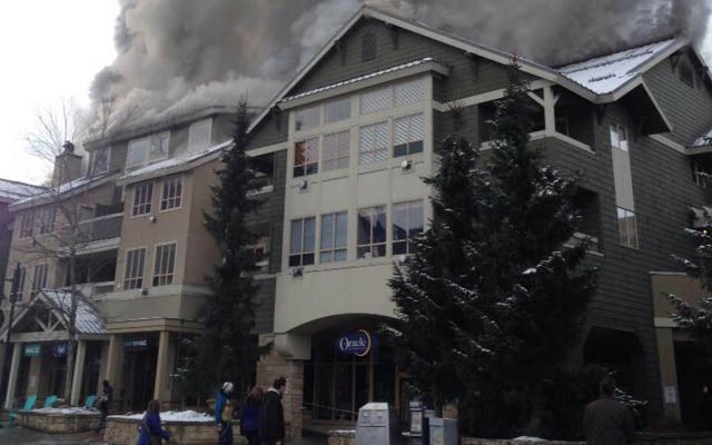 SMOKE DETECTED People strolling near Whistler Olympic Plaza were surprised to see smoke coming from the roof of the Tyndall Stone Lodge late in the morning on Saturday, Nov. 23. Photo by Eoin Logan/taxback.com