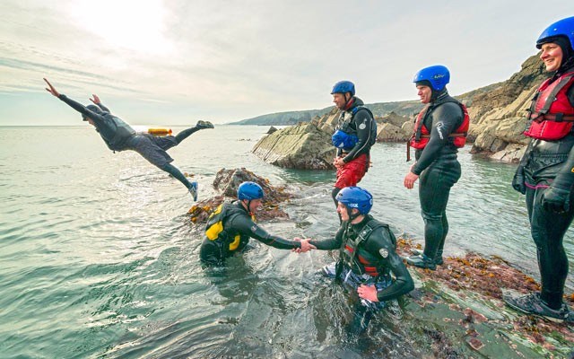 Coasteering is the inter-disciplinary adventure sport invented in Wales that combines swimming, rock climbing and cliff jumping. Photo supplied by Visit Wales.