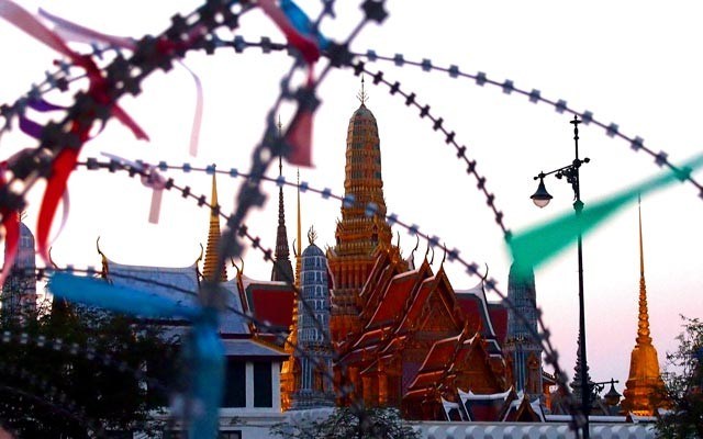 Bangkok wat and barbed wire. Photo by Steve Burgess