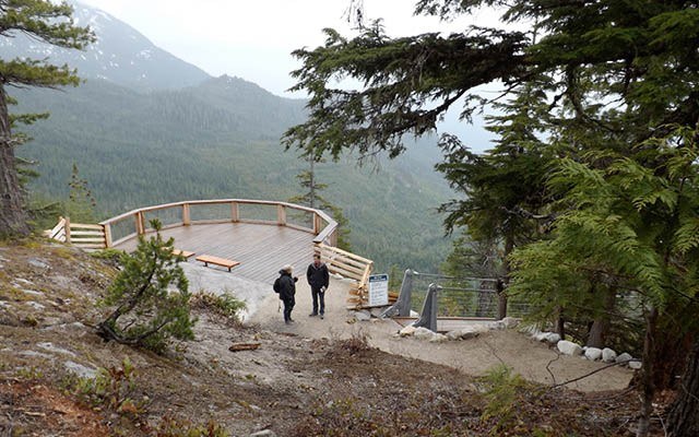 SUMMIT VIEW Jennifer Mooney and Stephane Perron were part of a group touring the gondola facilities in Squamish on May 8. PHOTO BY JOHN FRENCH