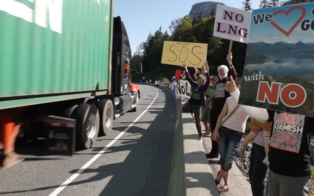 Energetic demonstration Protesters who oppose a liquefied natural gas plant on Howe Sound held placards on the edge of Highway 99 at Shannon Falls the day the Sea to Sky Gondola had its official opening. Photo by John French