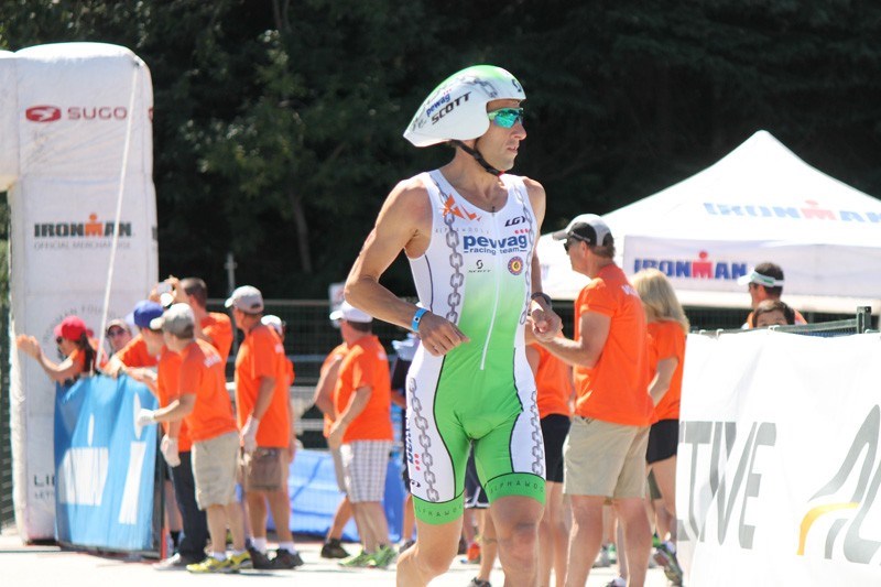 Marino Vanhoenacker goes through the bike-run transition with the lead on Sunday. He would hang on for the Ironman Canada pro men's victory. Photo by Eric MacKenzie