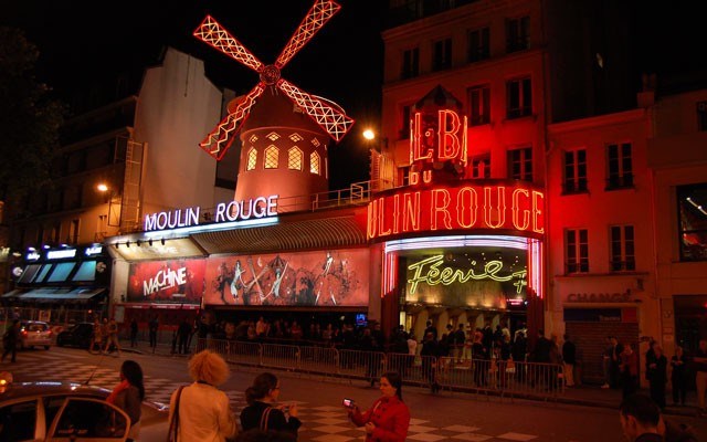 Our free walking tour of the trendy Montmartre neighbourhood starts at the Moulin Rouge cabaret. Photo: Steve MacNaull