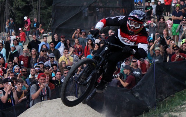 Brandon Semenuk rides his victory lap on the second run of Red Bull Joyride, which he won for the second year in a row and third time overall on Saturday at Crankworx Whistler. Photo by Eric MacKenzie