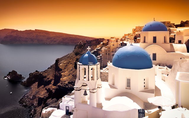 Cliffs of Santorini at sunset. Photo from <a href="http://shutterstock.com/">shutterstock.com</a>