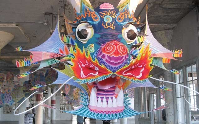 With Wind utilizes a Chinese dragon kite weaving between columns suspended from the ceiling. Photo by G.D. Maxwell