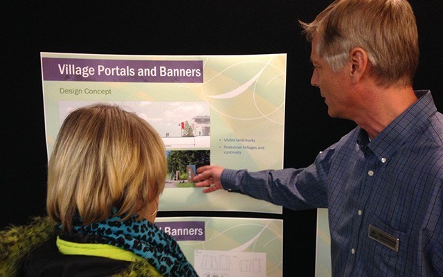 FINDING THE WAY Director of planning Mike Kirkegaard explains some details of the Village Portals and Banners project at an open house on Jan. 21. Photo by Braden Dupuis