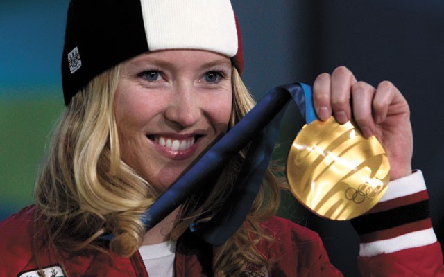 Ashleigh McIvor DeMerit (known then as Ashleigh McIvor) shows off the inaugural gold medal won in women's ski cross. Photo by Scott Brammer/Coastphoto.com