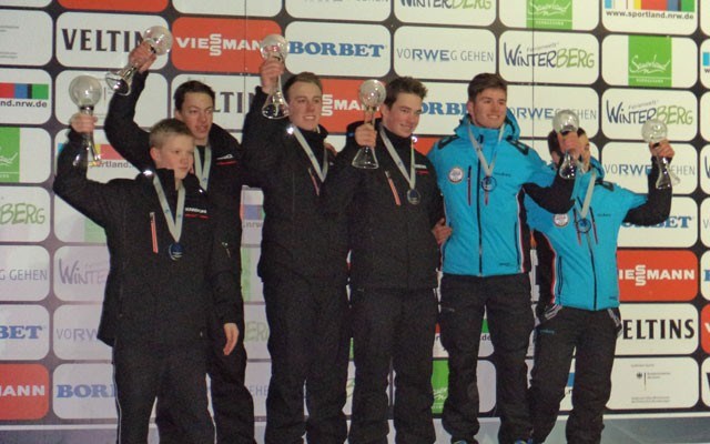 Gold and globes Local doubles lugers Matt Riddle and Reid Watts (third and fourth from left) lift their Crystal Globes after capturing the FIL Youth A World Cup titles in Winterberg, Germany on Feb. 7. Fellow Canadians Heath Karpyshyn and Evan Wildman were second (at left), while Romanians Vasile Gitlan and Flavius Craciun placed third (at right). Photo BY Jorge Ravenna